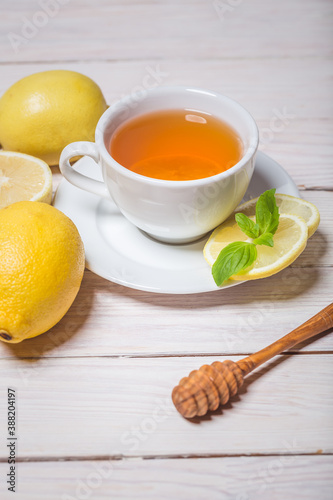 Ginger tea with mint, lemon and honey. Homemade warming tea for colds and flu.