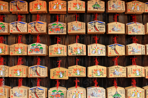 Japan- February 22, 2019: Many wooden fortune amulets hanging on wall in Japanese temple or shrine at Tokyo, Japan. Pattern of object, Wood material , Faith or belief of people in Asian and Religion. 