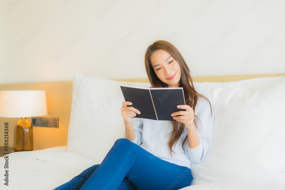 Portrait beautiful young asian woman read book on bed Portrait beautiful young asian woman read book on bed