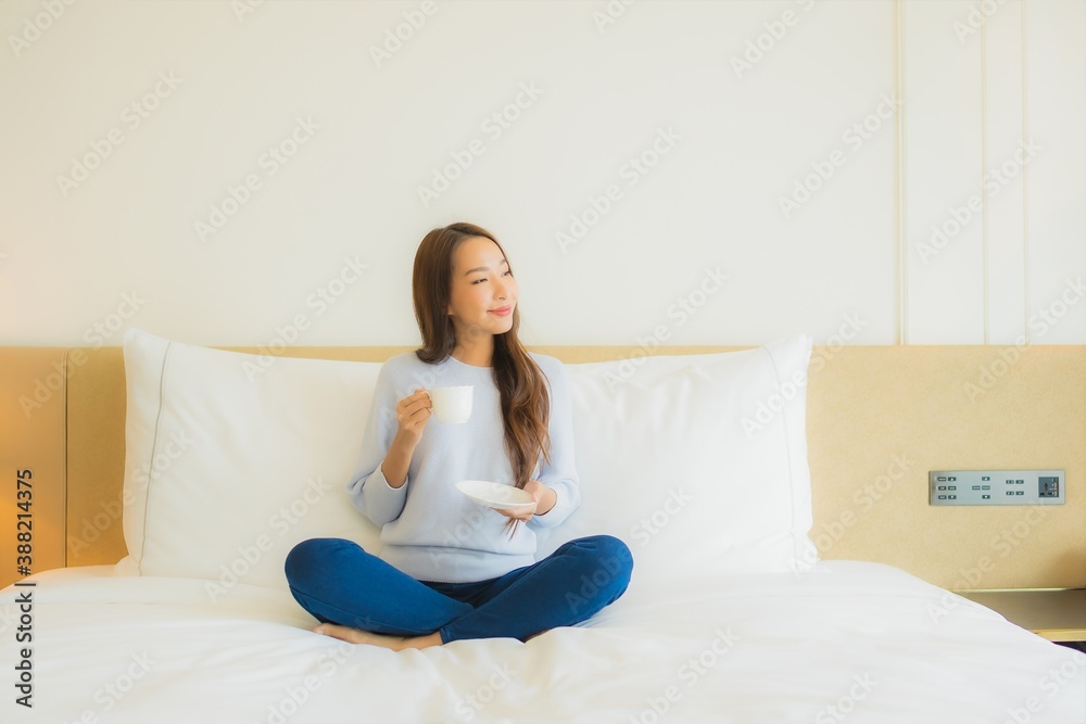 Portrait beautiful young asian woman smile relax leisure on bed