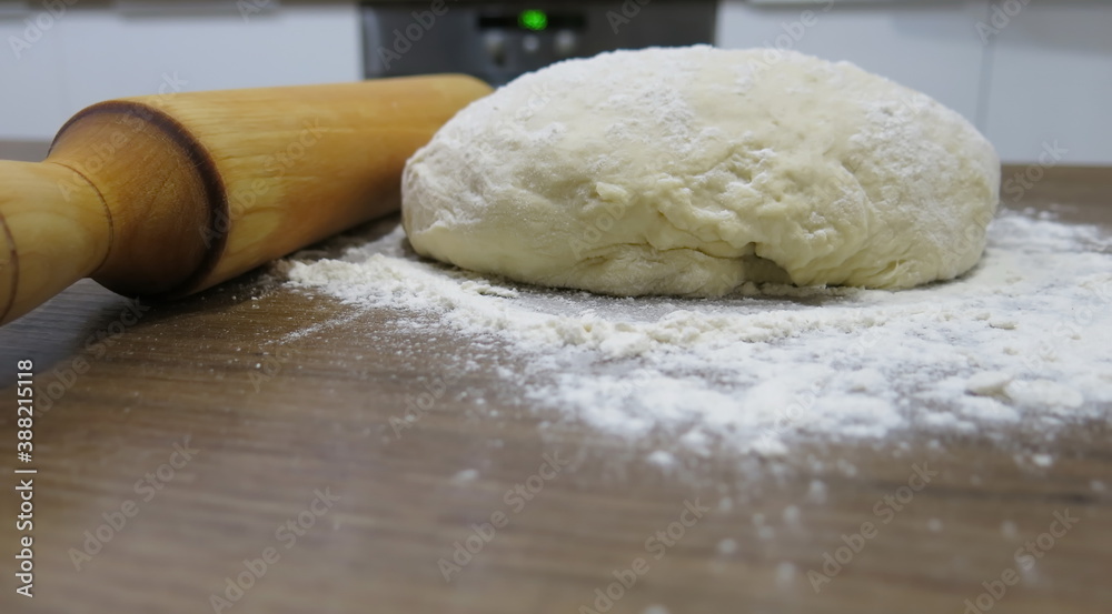 Dough, rolling pin and flour Dough, rolling pin and flour