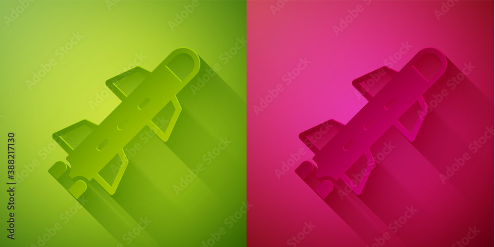Paper cut Rocket icon isolated on green and pink background. Paper art style. Vector. Paper cut Rocket icon isolated on green and pink background. Paper art style. Vector.