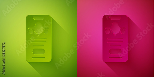 Paper cut Smartphone with electronic boarding pass airline ticket icon isolated on green and pink background. Passenger plane mobile ticket for web and app. Paper art style. Vector.