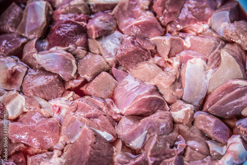 Preparing chunks of pork and beef meat for goulash