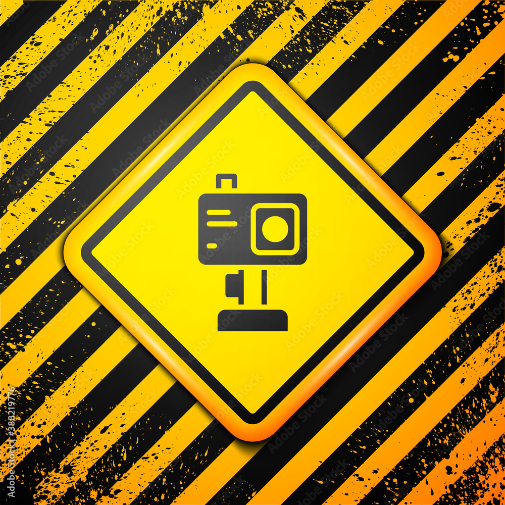 Black Action extreme camera icon isolated on yellow background. Video camera equipment for filming extreme sports. Warning sign. Vector. Black Action extreme camera icon isolated on yellow background. Video camera equipment for filming extreme sports. Warning sign. Vector.
