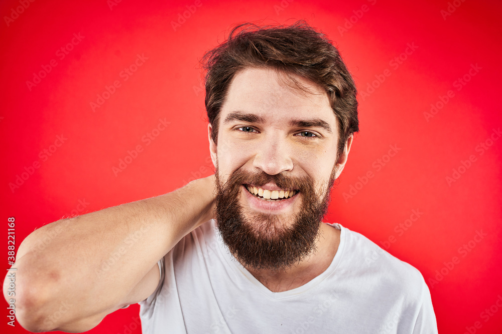 Bearded man fun emotions lifestyle cropped view white t-shirt red background Bearded man fun emotions lifestyle cropped view white t-shirt red background
