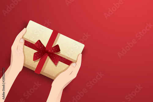 hands holding present box decorated with bow vector illustration © santima.studio (02)