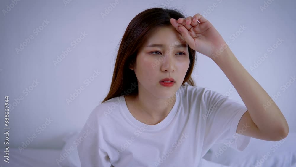 Sick Asian woman wake up and headache feeling have a fever at the bed in the morning. 4K
Sick Asian woman wake up and headache feeling have a fever at the bed in the morning. 4K