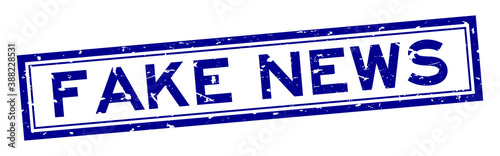 Grunge blue fake news word rubber business seal stamp on white background