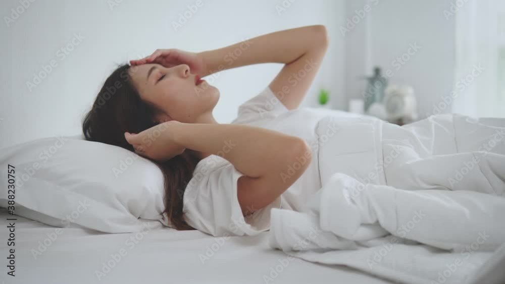 Asian young woman at the bed can't fall asleep, worry, stress, nervous with something. 4K Asian young woman at the bed can't fall asleep, worry, stress, nervous with something. 4K