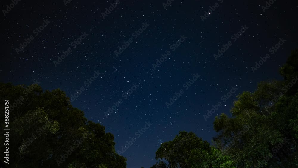 Starry night in mountains Time lapse. Milky way galaxy stars moving over countryside traffic Starry night in mountains Time lapse. Milky way galaxy stars moving over countryside traffic
