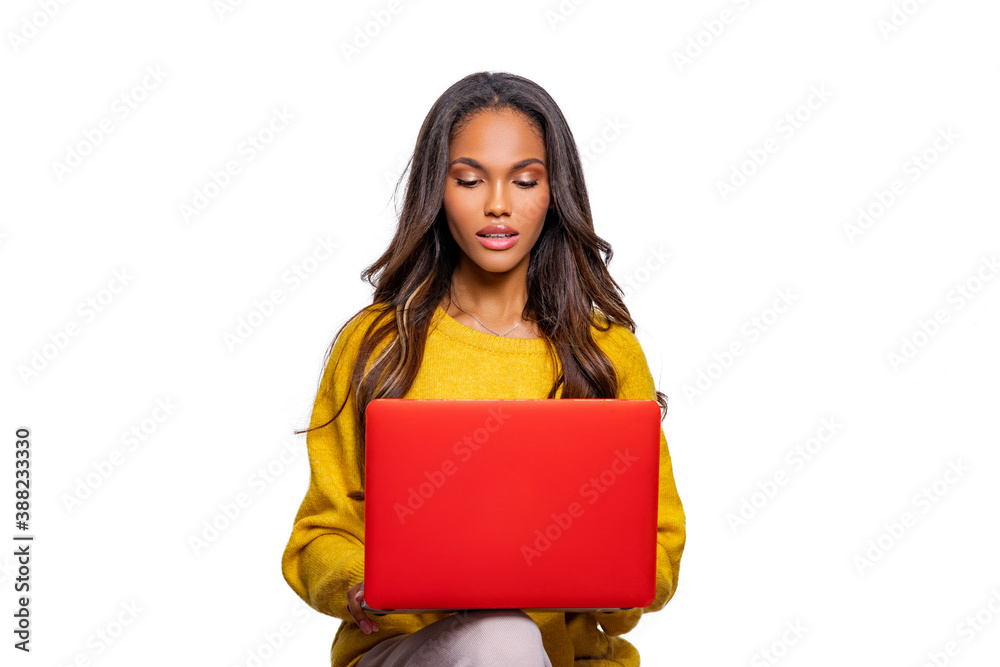 Obraz premium Image of cheerful African American woman using laptop. Isolated. Person and Laptop.