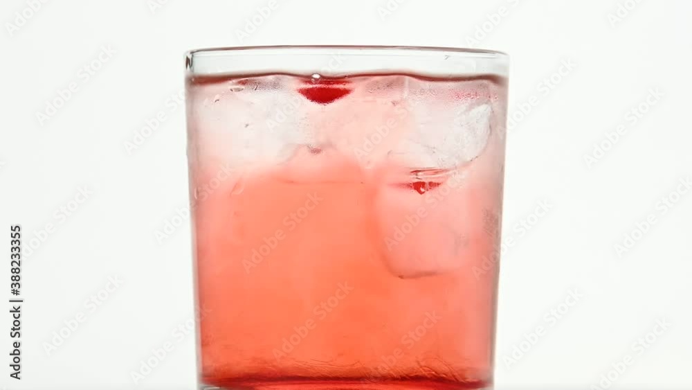 custom made wallpaper toronto digitalIce cubes spin in glass of pink cocktail on white