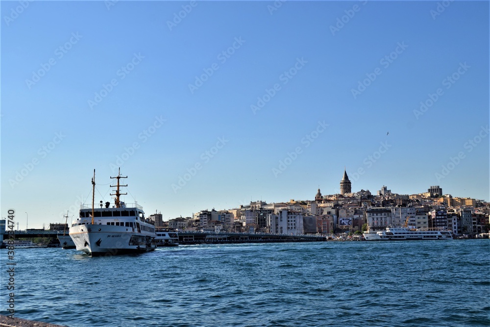 Panoramic View  in Mega City Istanbul. Marmara sea and public transportation ship with Galata Tower background.