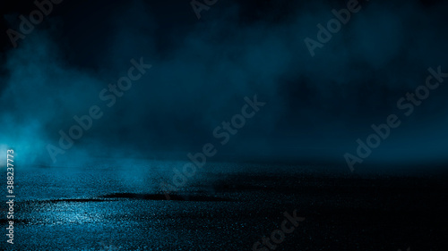 Dark cold wet street, asphalt, neon light. Reflection of neon in water. Empty night street scene, night city, smoke. abstract dark empty scene abstract night landscape neon blue light silhouettes