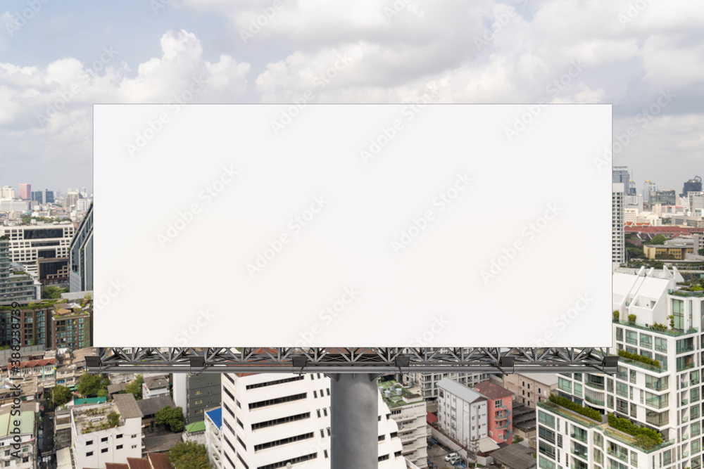 Blank white road billboard with Bangkok cityscape background at day time. Street advertising poster, mock up, 3D rendering. Front view. The concept of marketing communication to promote or sell idea.