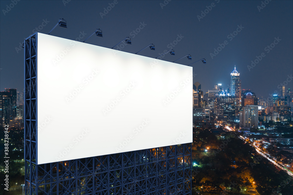 Blank white road billboard with Bangkok cityscape background at night time. Street advertising poster, mock up, 3D rendering. Side view. The concept of marketing communication to sell idea. Blank white road billboard with Bangkok cityscape background at night time. Street advertising poster, mock up, 3D rendering. Side view. The concept of marketing communication to sell idea.