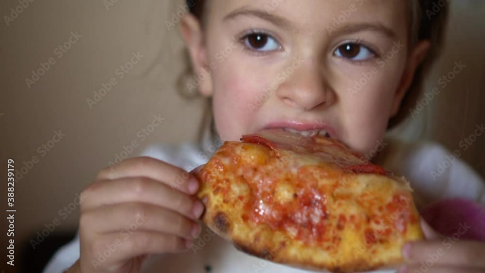 Little girl aged five eating p Little girl aged five eating p