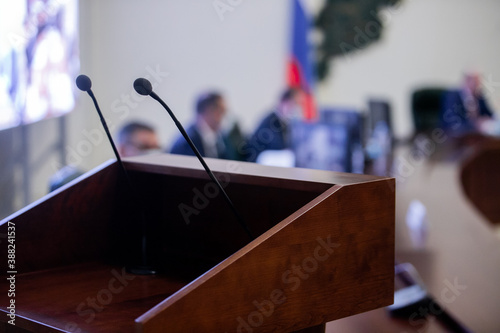 Conference room or seminar meeting room in business event. Session of Government. Academic classroom training course in lecture hall. blur abstract background. working in modern bright office indoor