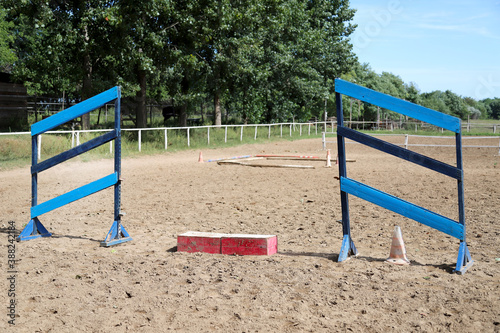 Colorful photo of equestrian obstacles. Empty field for horse training event