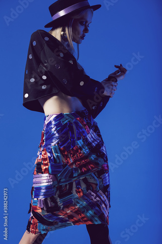 Posing model in multi skirt and black top