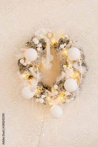 Christmas fir-tree wreath with lights on white background. Vintage New Year decorations. Spruce wreath. Christmas mood. Celebrating of New Year