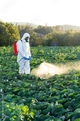 farmer spraying pesticide field mask harvest protective chemical