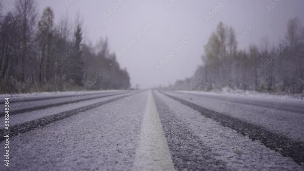 Snowfall on a winter road. Slow motion Snowfall on a winter road. Slow motion