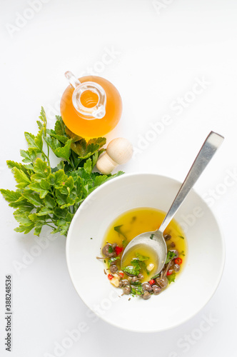 linguine made with garlic, oregano, capers, olives, lemon peel, mackerel and a drop of aromatic oil with anchovies (colatura di alici in italian) photo