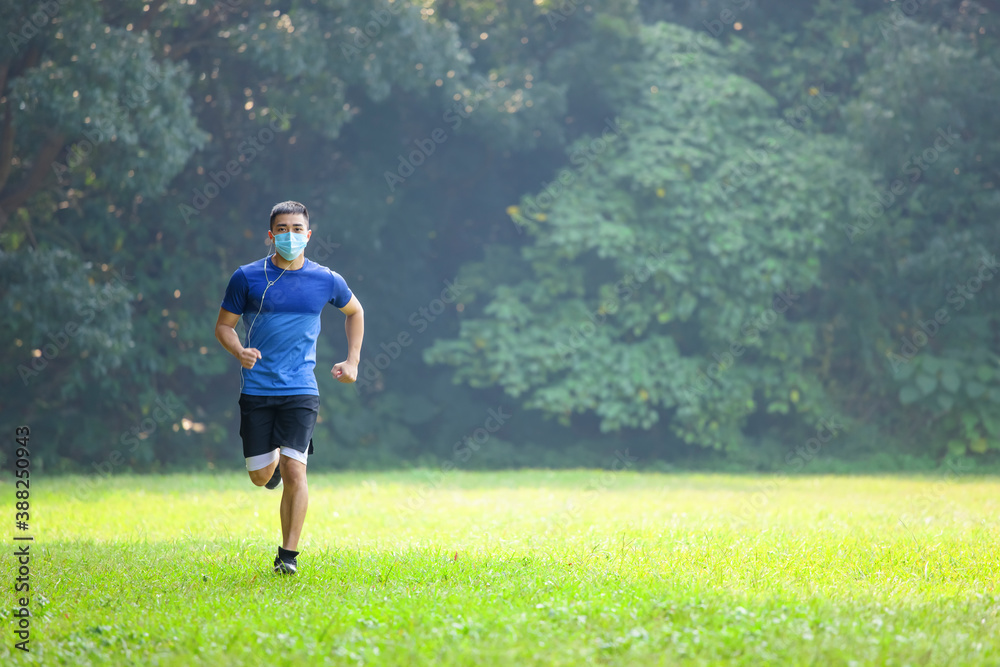man in face mask and running in the park man in face mask and running in the park