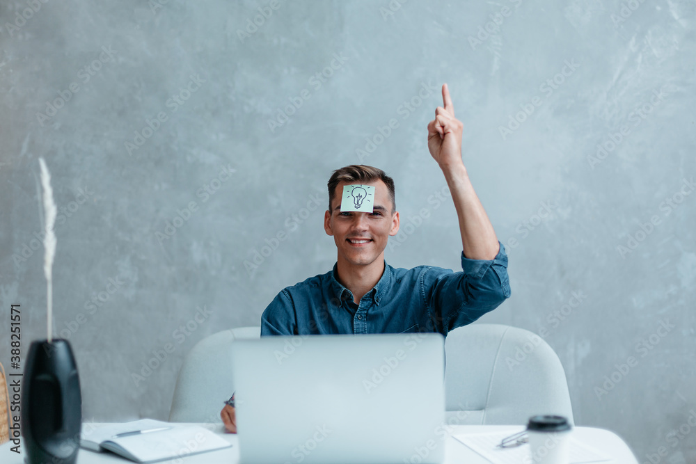 Satisfied man with raised hand thinking about good creative idea. Satisfied man with raised hand thinking about good creative idea.
