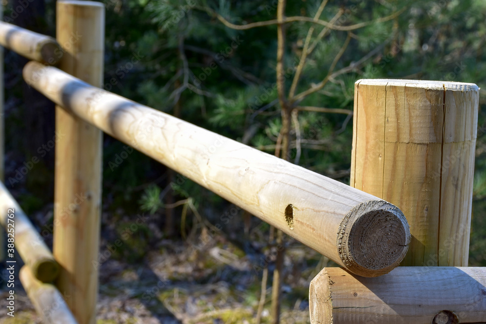 Construction of wooden bridge railings in the forest for tourism Construction of wooden bridge railings in the forest for tourism