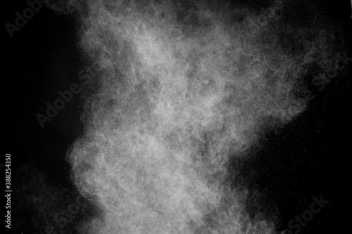 Flying white powder on isolated black background, dust debris. Creative hurricane storm tornado concept, copy text space. Dark sand abstract screensaver, explosion burst high quality texture