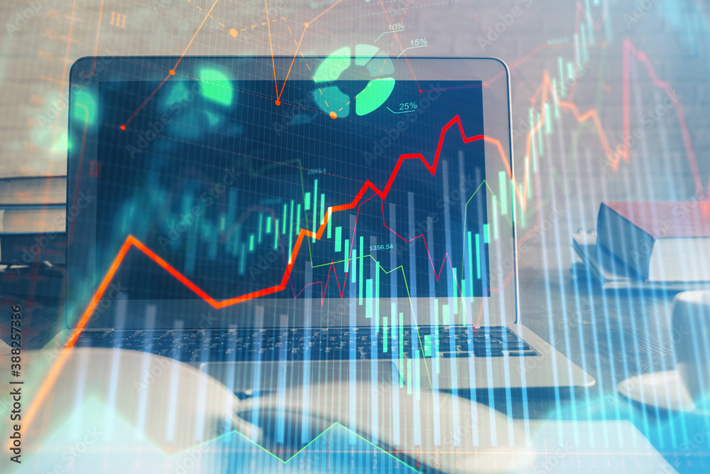 Forex market chart hologram and personal computer background. Double exposure. Concept of investment. Forex market chart hologram and personal computer background. Double exposure. Concept of investment.