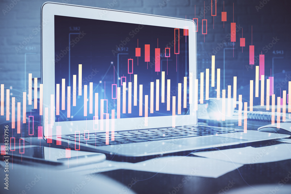 Forex Chart hologram on table with computer background. Double exposure. Concept of financial markets. Forex Chart hologram on table with computer background. Double exposure. Concept of financial markets.