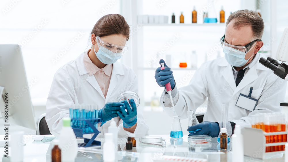 close up. scientists are testing a new vaccine. close up. scientists are testing a new vaccine.
