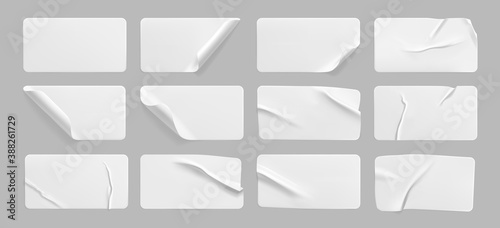 White glued crumpled stickers with curled corners mock up set. Blank white adhesive paper or plastic sticker label with wrinkled and creased effect.