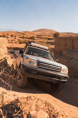 Off road 4x4 vehicle in dry mountainous desert area 
