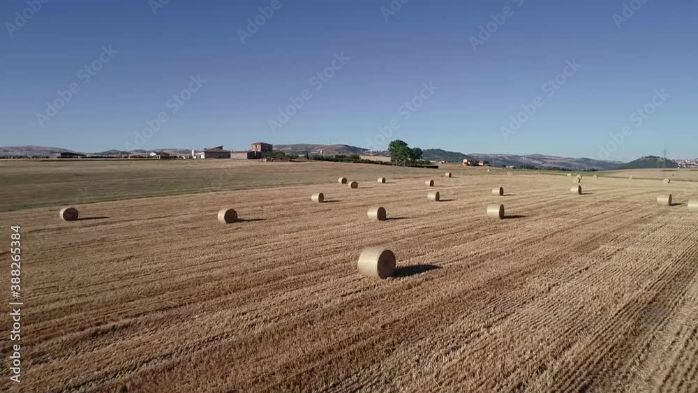 Drone View Of Hay Bales In A Wheat Field In Italy