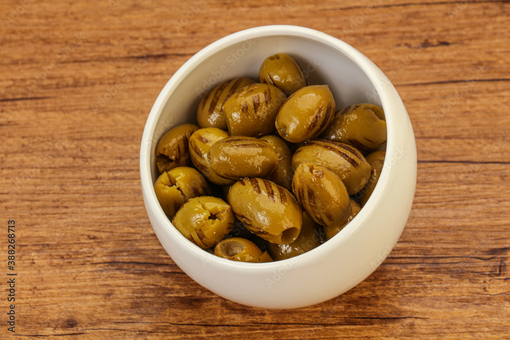 Green grilled olives in the bowl Green grilled olives in the bowl