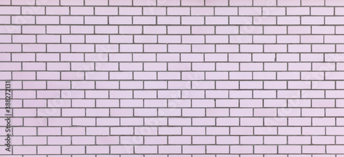 Wide light pink brick wall texture. New clean masonry. Panoramic view. Bricks background. Banner