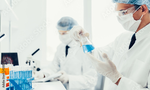 background image scientists are conducting research in the laboratory.
