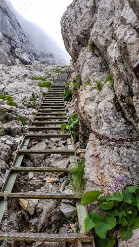 Fotografija A metal ladder leading up a steep slope to the top of Hochschwab, Austrian Alps