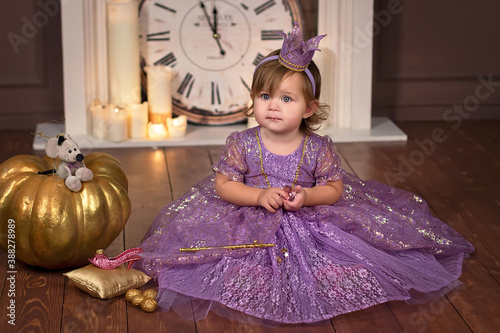  Little princess sitting on the floor against the background of a large clock. Next to her are the magic pumpkin, slipper, mouse. Fairy tale.