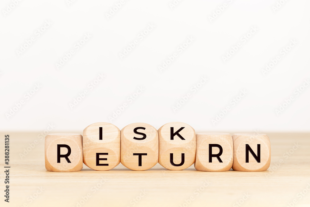 Risk Return concept. Wooden block with text on table Risk Return concept. Wooden block with text on table