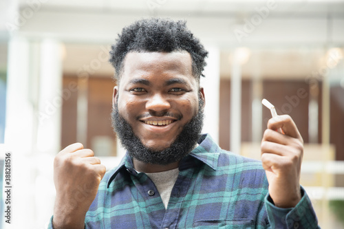 Fotografia Happy smiling successful African black man  quit smoking, smoking ban concept