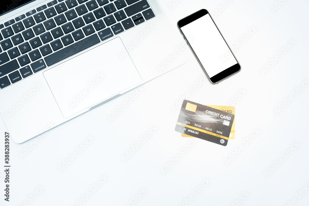 Fototapeta premium close up credit card laptop and amartphone on white background for online shopping