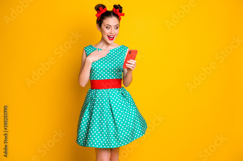 Photo of amazed girl blogger use smartphone wear turquoise clothes isolated bright shine color background