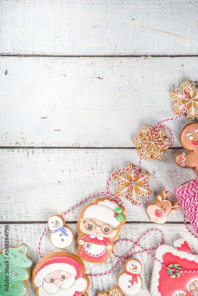 Christmas background with homemade gingerbread cookies. Traditional winter festive baking, Flat lay, white wooden background copy space.
