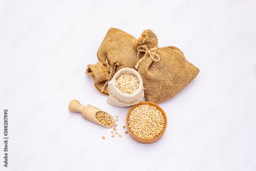 Whole peeled pearl barley grains isolated on white background Whole peeled pearl barley grains isolated on white background